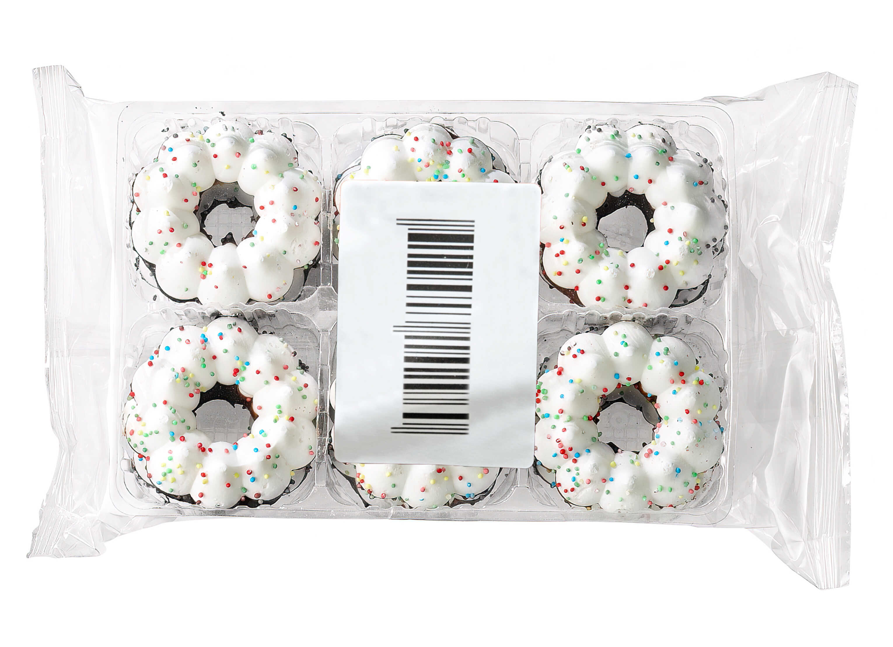 Sechs kleine Donuts mit weißem Zuckerguss und bunten Streuseln in einer durchsichtigen Verpackung.