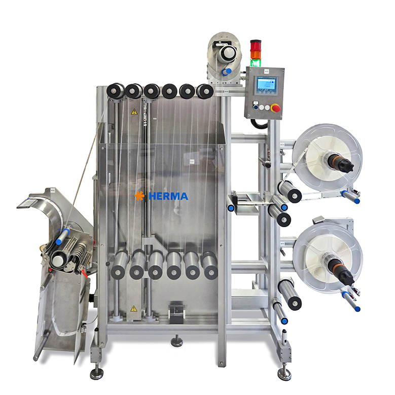 Automatische Etikettiermaschine mit mehreren Rollen, Steuerungseinheit und Edelstahlrahmen. Ideal für industrielle Anwendungen.