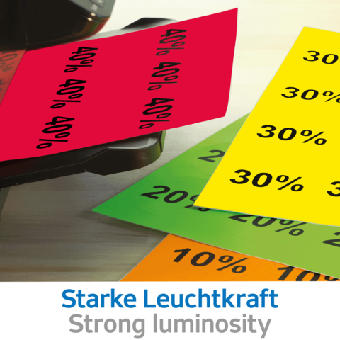 Bunte Rabattkarten in verschiedenen Farben mit Prozentangaben (10%, 20%, 30%, 40%) auf einem Tisch. Text: "Starke Leuchtkraft".